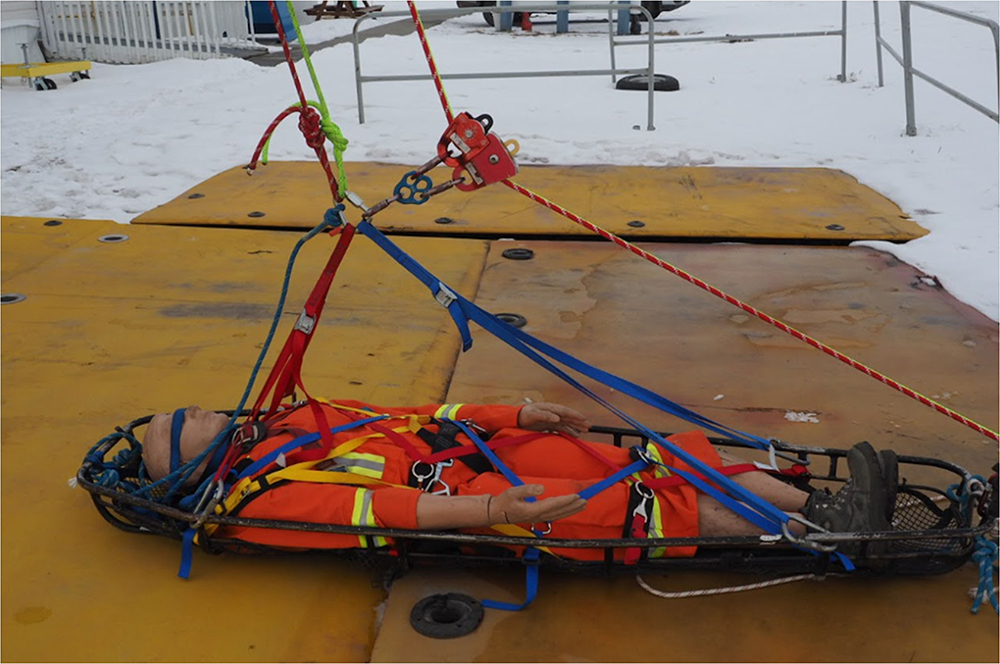person laying on rescure board rig rescue training